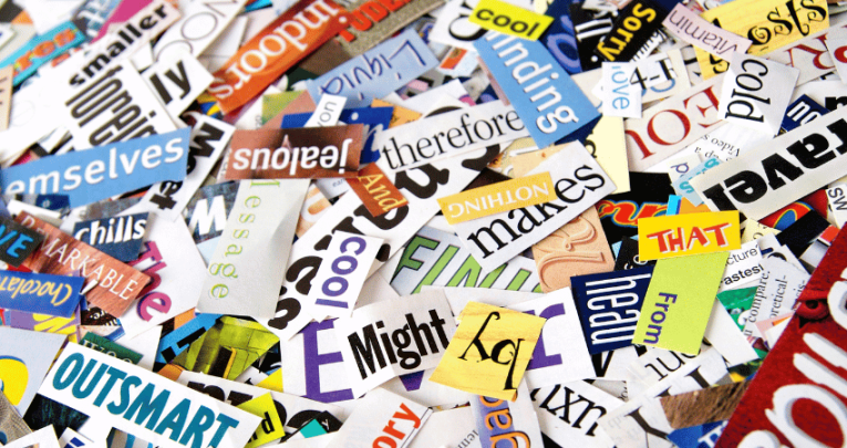 Ambitious vocabulary words cut out of magazines