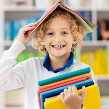 Boy in library for International Literacy Day