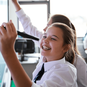 Schoolgirl doing KS3 maths on board