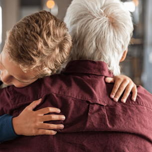 Boy hugging man, representing attachment disorder in children