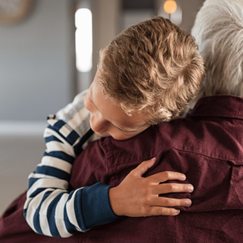 Boy hugging man, representing attachment disorder in children