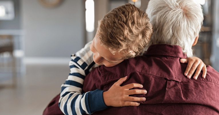 Boy hugging man, representing attachment disorder in children