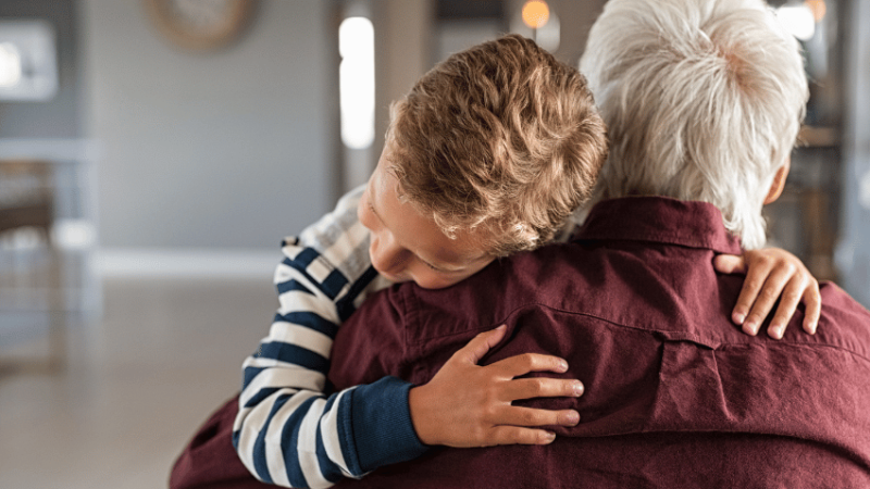 Boy hugging man, representing attachment disorder in children