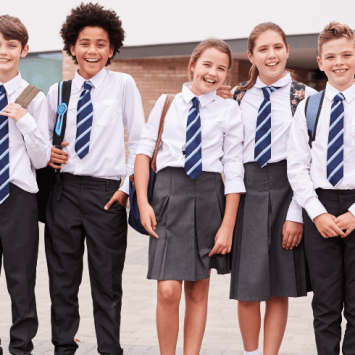 Happy children wearing school uniform