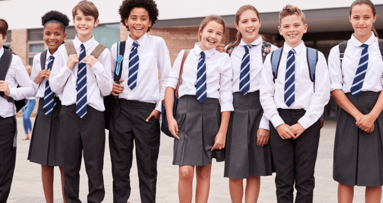 Happy children wearing school uniform