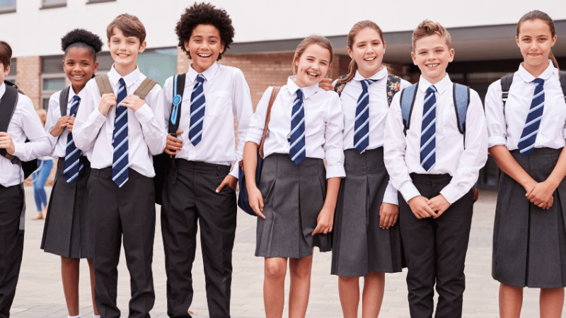 Happy children wearing school uniform