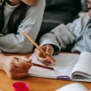 Child completing homework, representing the idea of a homework policy