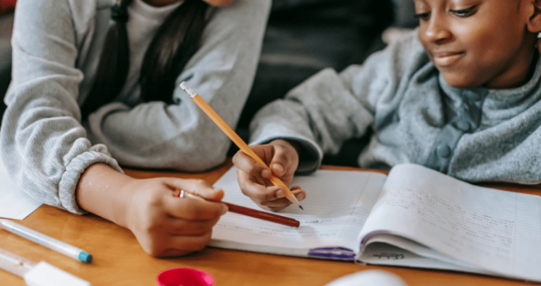 Child completing homework, representing the idea of a homework policy