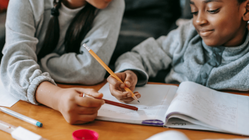 Child completing homework, representing the idea of a homework policy