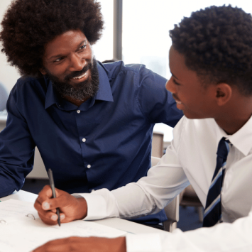 Teacher helping student with GCSE English Language revision