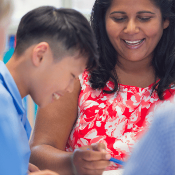 Teacher working with pupils with SLCN