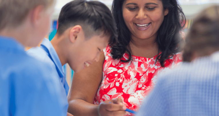 Teacher working with pupils with SLCN