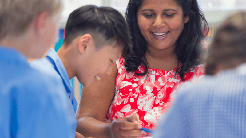 Teacher working with pupils with SLCN