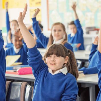 Schoolchildren raising their hands, representing working memory