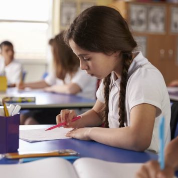 Schoolgirl doing reading comprehension activities