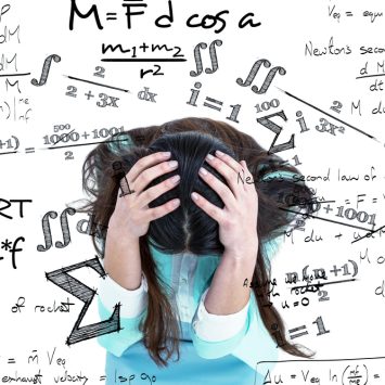 Student with head in hands, surrounded by maths symbols, representing maths anxiety