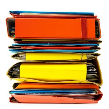 isolated stack of colourful document storage files