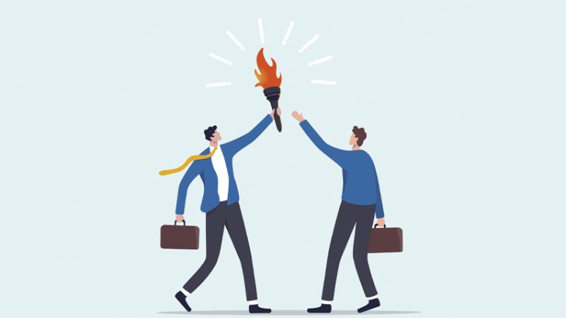 Cartoon illustration of one besuited figure passing a torch to another, representing leadership in schools