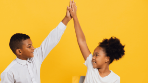 Talk partners high-fiving each other