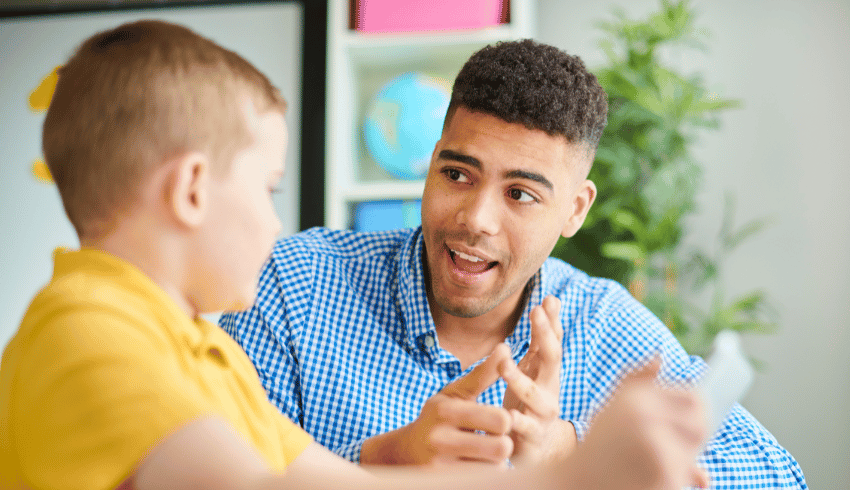 Child and teacher talking