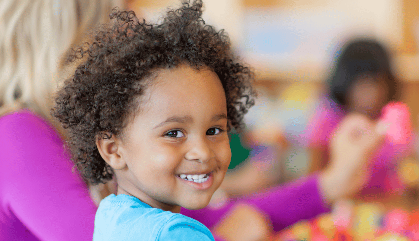 Child in Early Years with big smile