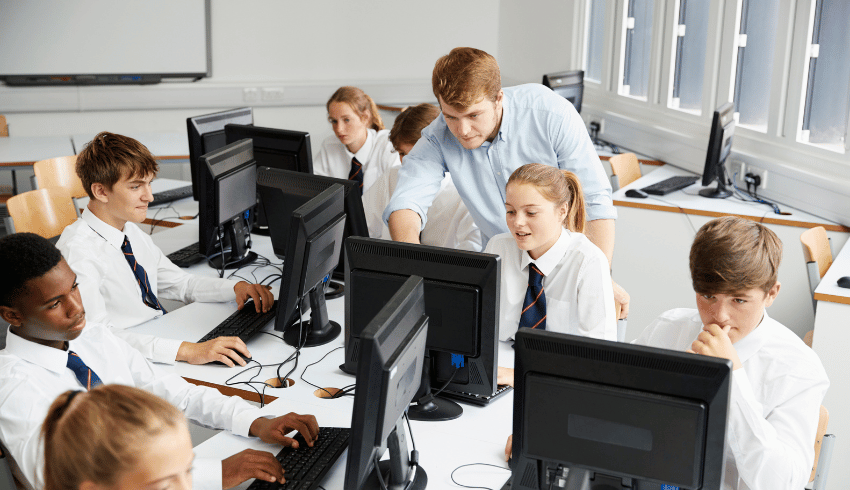 Teenagers in computer lab, representing school attendance