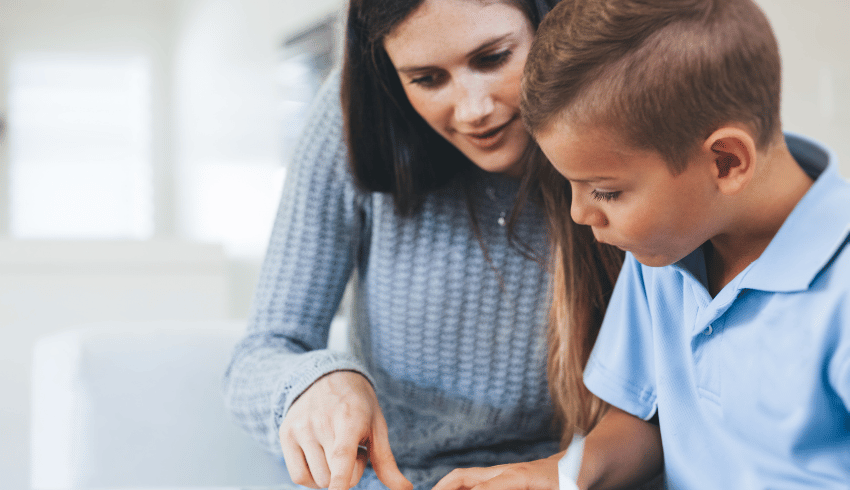 Teacher and child working together