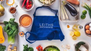 A Leiths Academy bag surrounded by fresh ingredients