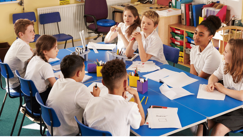 Year 6 children talking around table