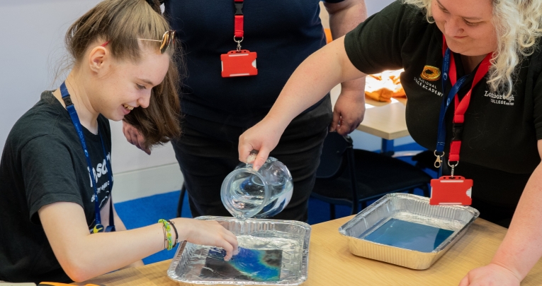 A secondary school girl taking part in a science experiment