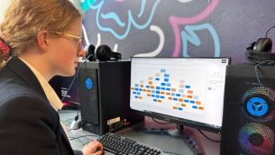 A secondary school girl working at a computer