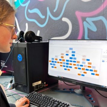 A secondary school girl working at a computer