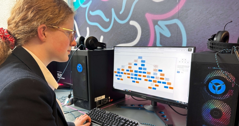 A secondary school girl working at a computer