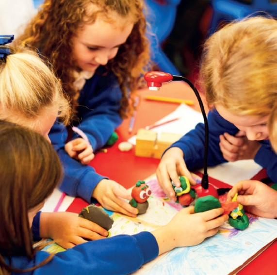 School children creating an animation using plasticine figures and Hue Animation Studio