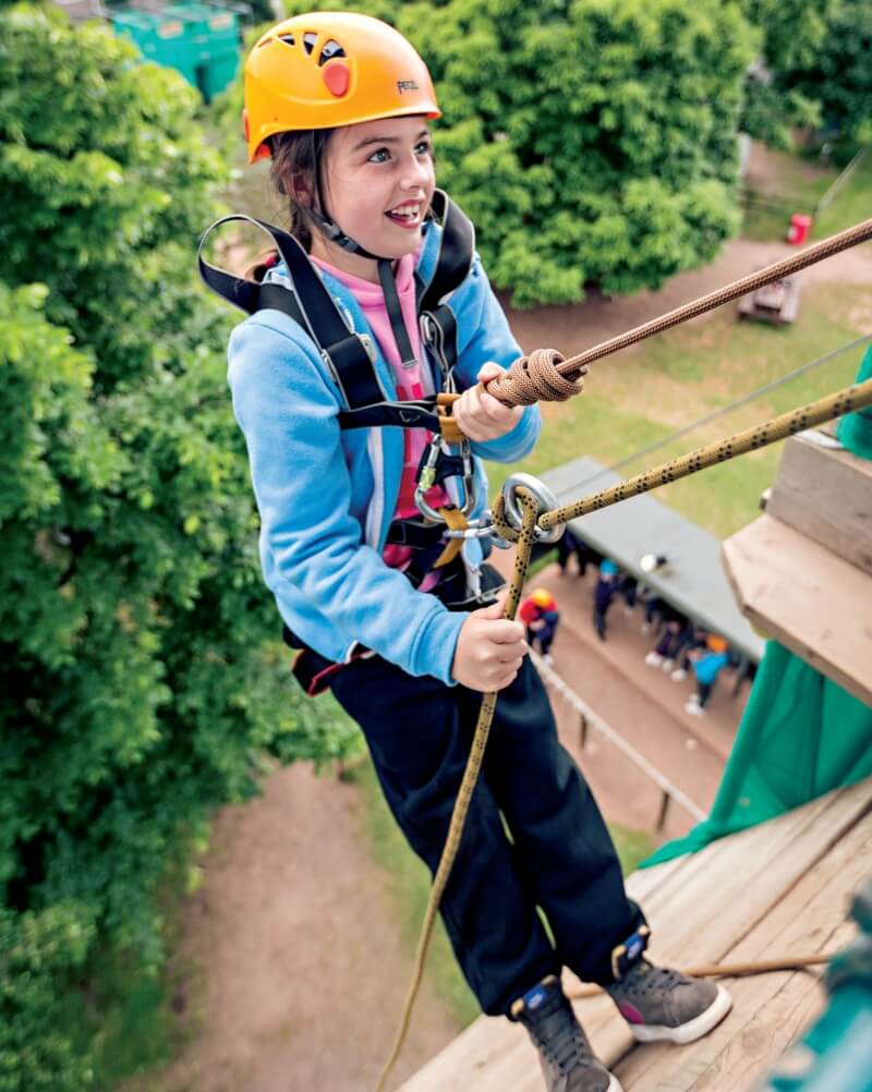 A school girl abseiling at a Kingswood centre