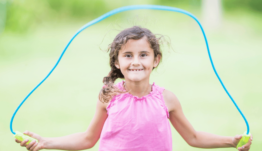 Girl skipping, representing the idea of teaching handwriting