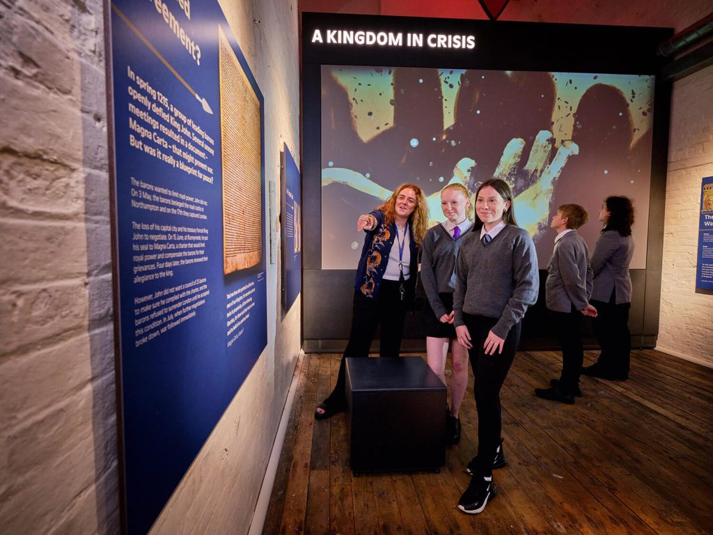 Two secondary school girls with a teacher in a museum at Dover Castle