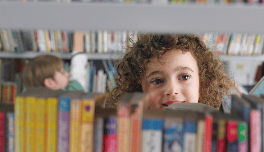 Child browsing school library