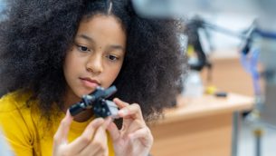 A school girl in an engineering classroom