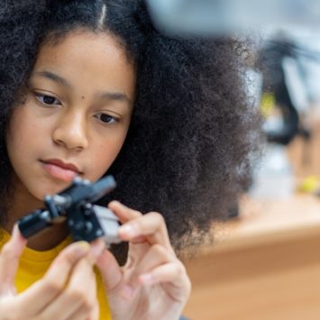 A school girl in an engineering classroom