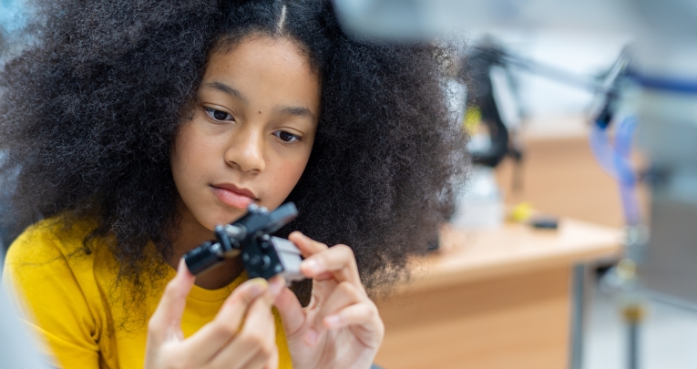 A school girl in an engineering classroom