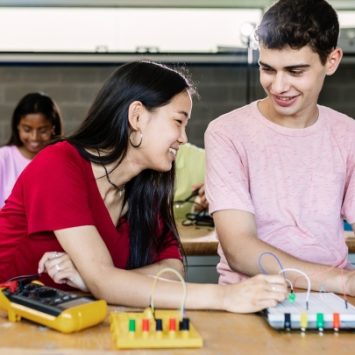 Two students in a technology classroom