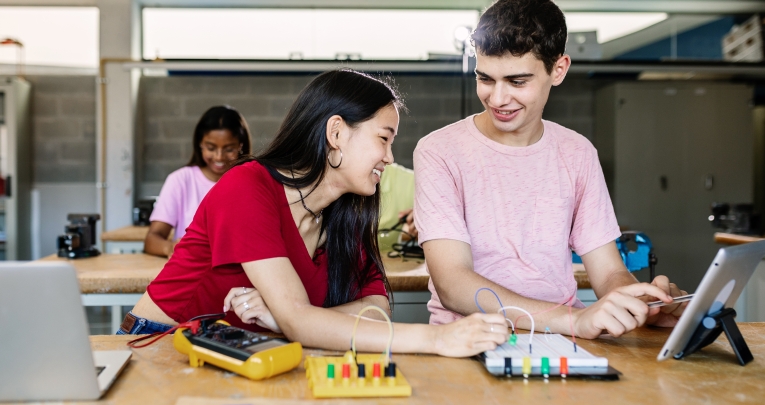 Two students in a technology classroom