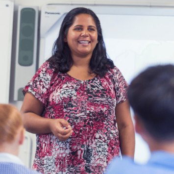 Teacher at front of class, representing scaffolding in education