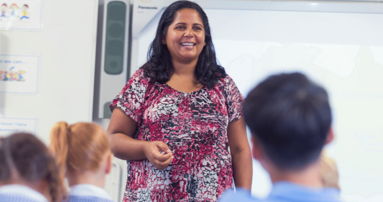 Teacher at front of class, representing scaffolding in education