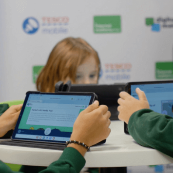 A group of primary school children looking at tablets