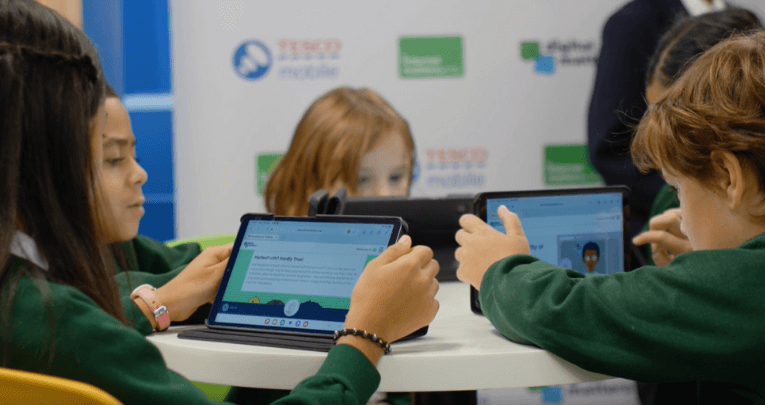 A group of primary school children looking at tablets