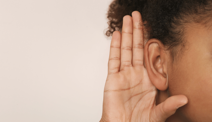 Girl putting hand up to ear, representing listening partners