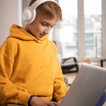 Boy on laptop, representing alternative provision