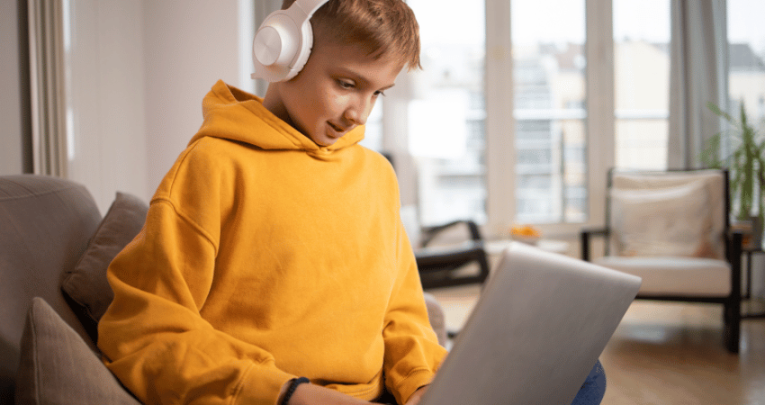 Boy on laptop, representing alternative provision